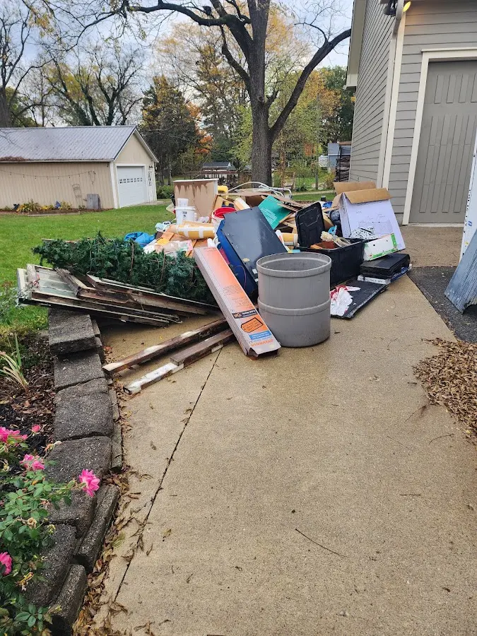 Dumpster being loaded with debris for Estate Cleanout Dumpster Rental in Hillsboro